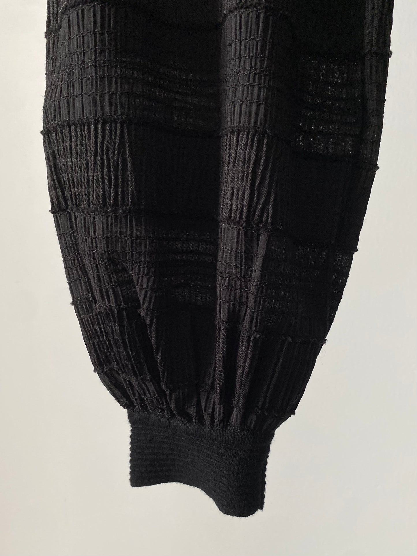 Sheer sleeve combination knit